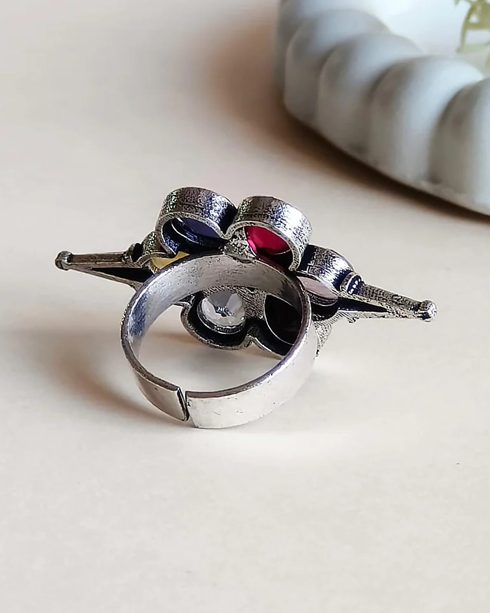 Oxidised silver-look brass adjustable ring shaped as a flower set with yellow, blue, pink, red and purple stones