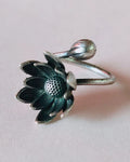 Oxidised silver-look brass adjustable ring with an open lotus bloom and a closed lotus bud on the wraparound band