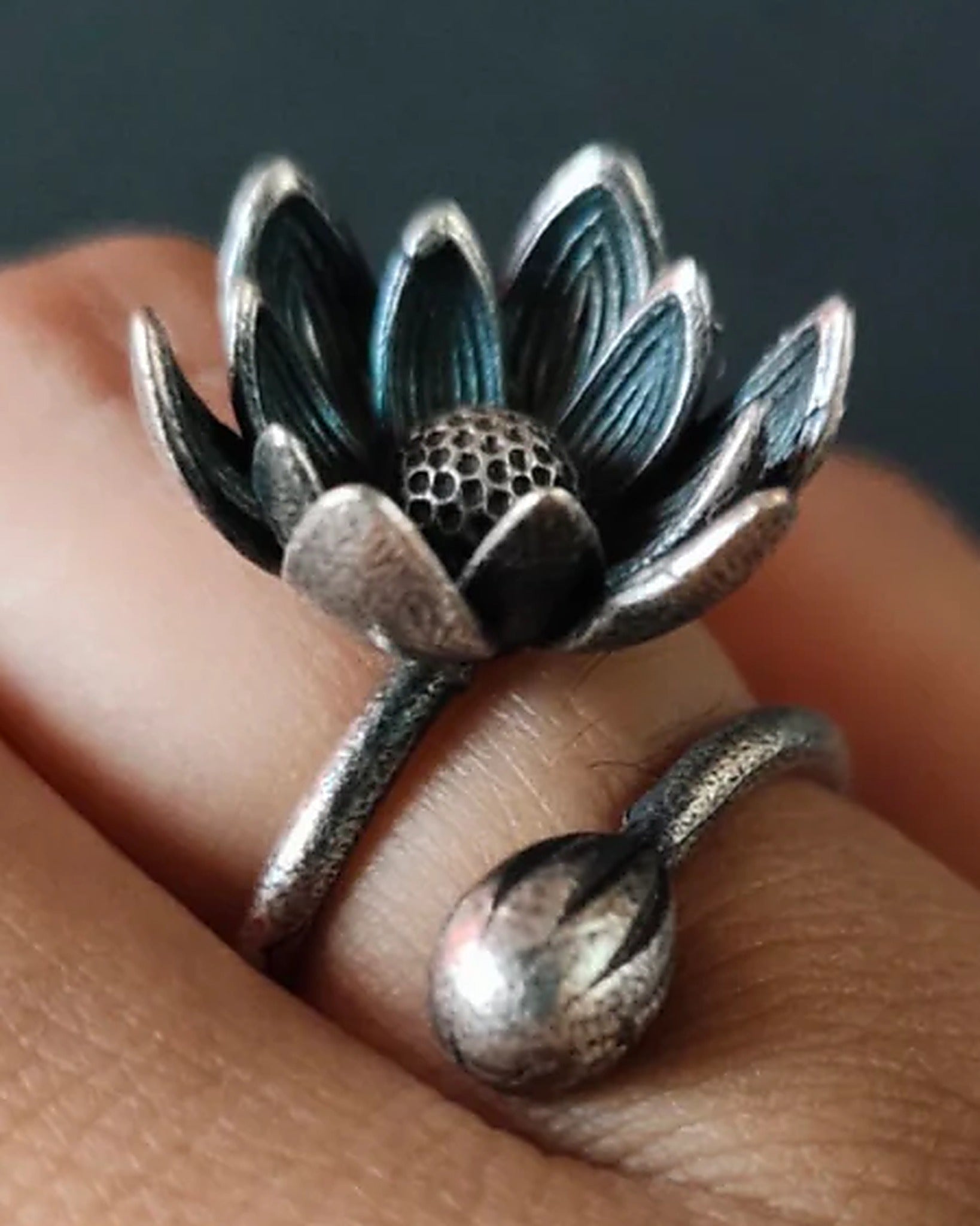 Oxidised silver-look brass adjustable ring with an open lotus bloom and a closed lotus bud on the wraparound band