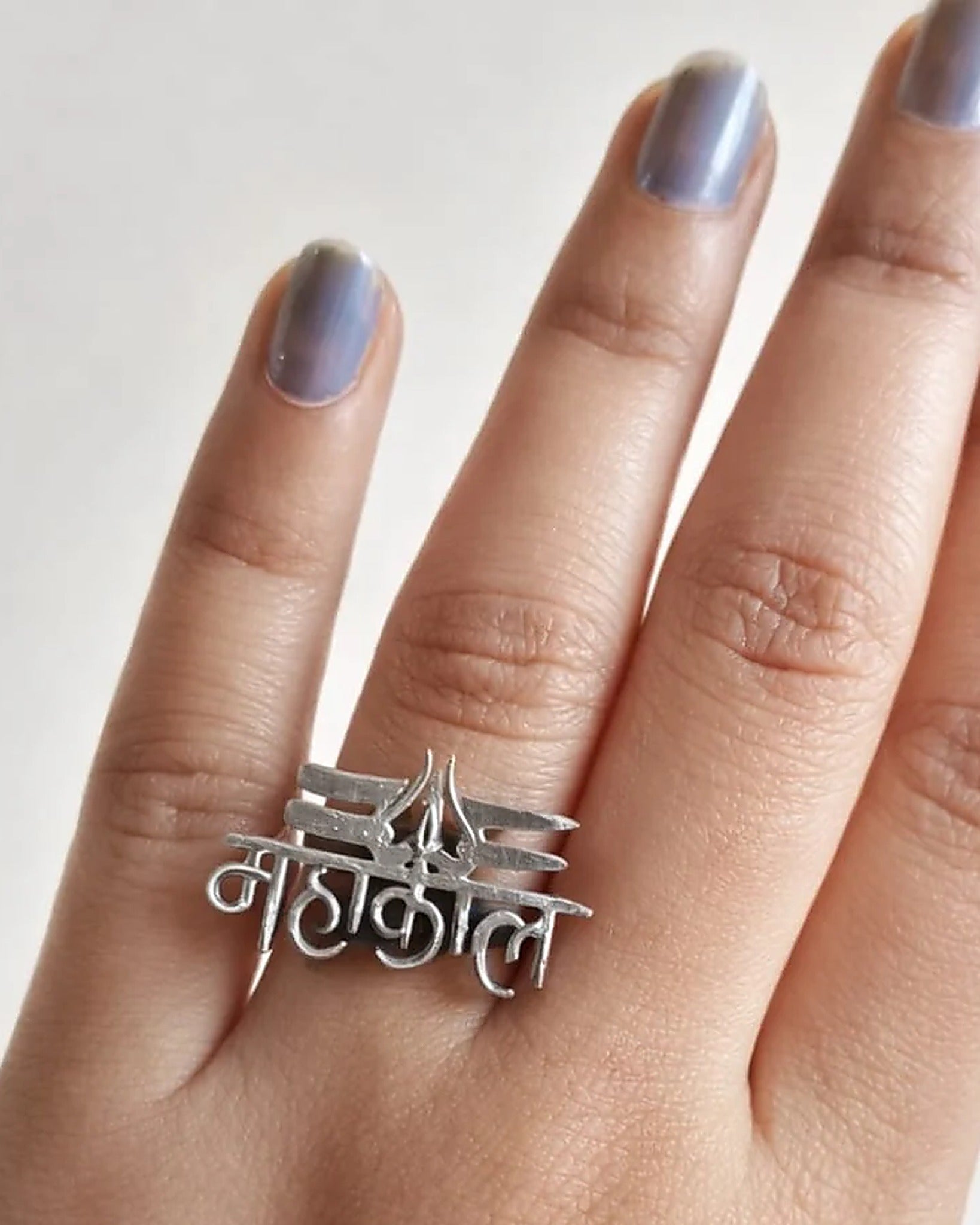 Oxidised silver-look brass statement ring with the Devanagari word महाकाल cut out and a trishul motif