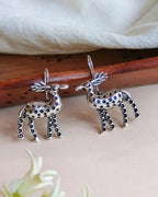 Oxidised silver-look brass drop earrings shaped as stags decorated with raised beadwork