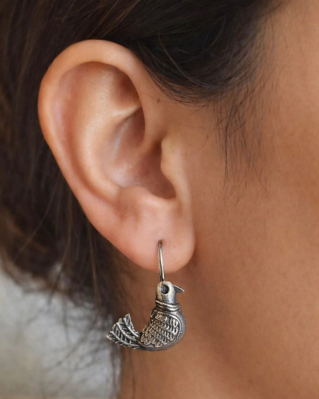 Oxidised silver-look brass drop earrings shaped as a bird in flight with fine engraved detailing