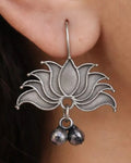Oxidised silver-look brass drop earrings shaped as an open lotus with small ghungroo bells beneath