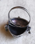 Oxidised silver-look brass adjustable statement ring featuring a crowned goddess face