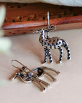 Oxidised silver-look brass drop earrings shaped as stags decorated with raised beadwork