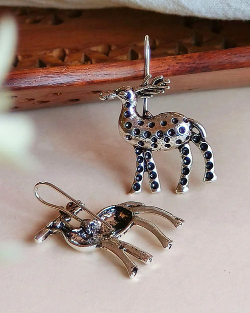 Oxidised silver-look brass drop earrings shaped as stags decorated with raised beadwork