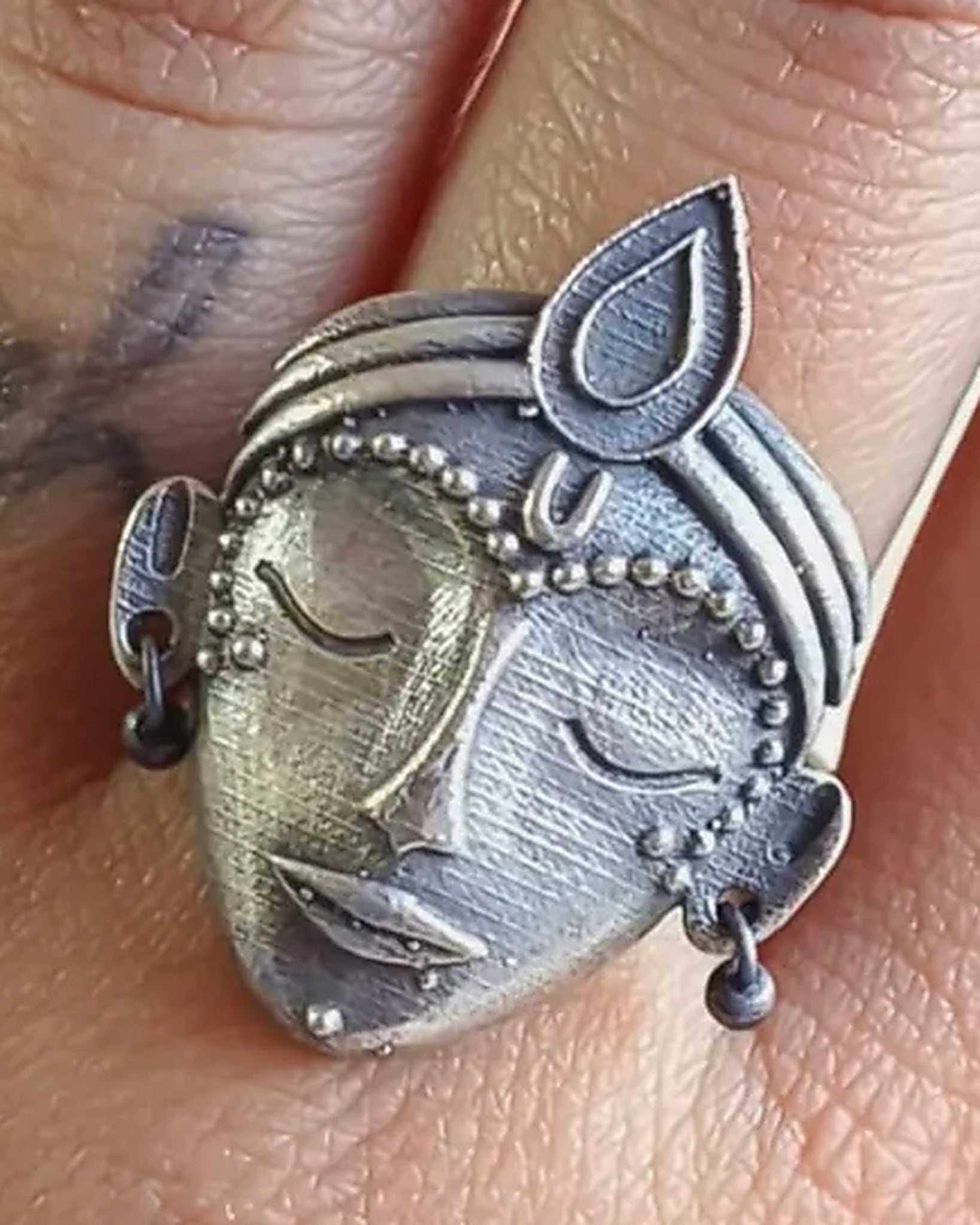 Oxidised silver-look brass adjustable statement ring featuring a crowned goddess face