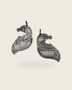 Oxidised silver-look brass drop earrings shaped as a peacock in fine open filigree work