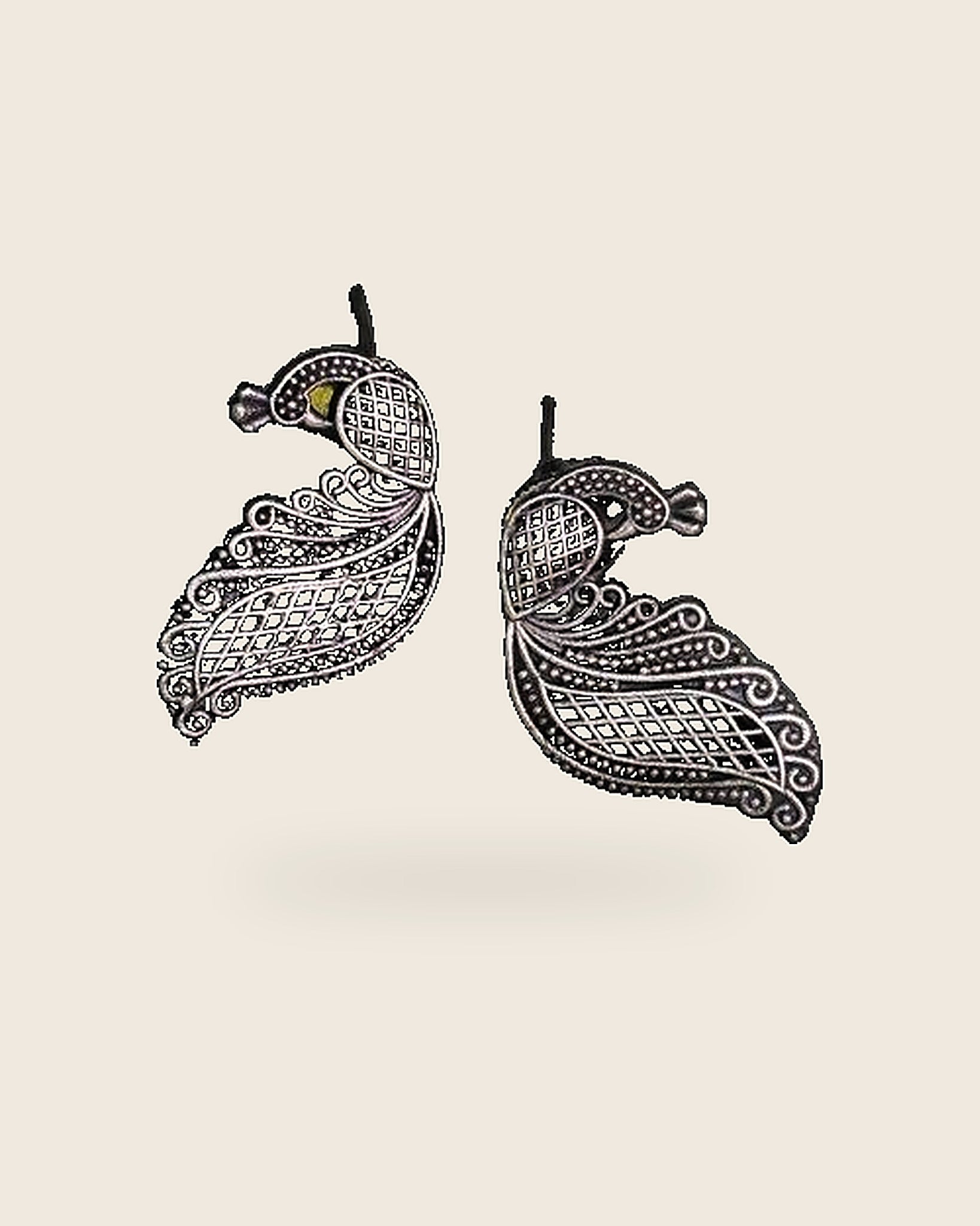 Oxidised silver-look brass drop earrings shaped as a peacock in fine open filigree work