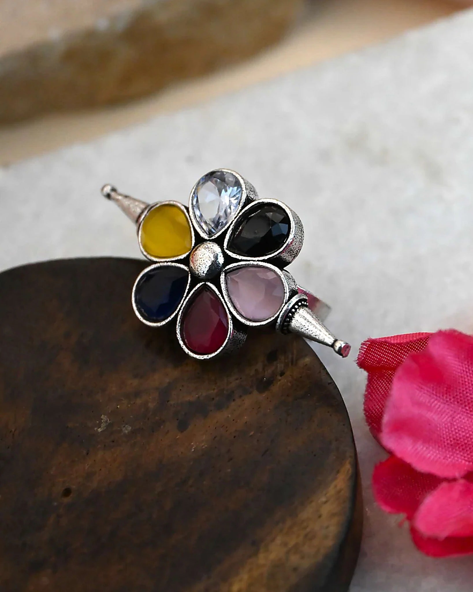 Oxidised silver-look brass adjustable ring shaped as a flower set with yellow, blue, pink, red and purple stones