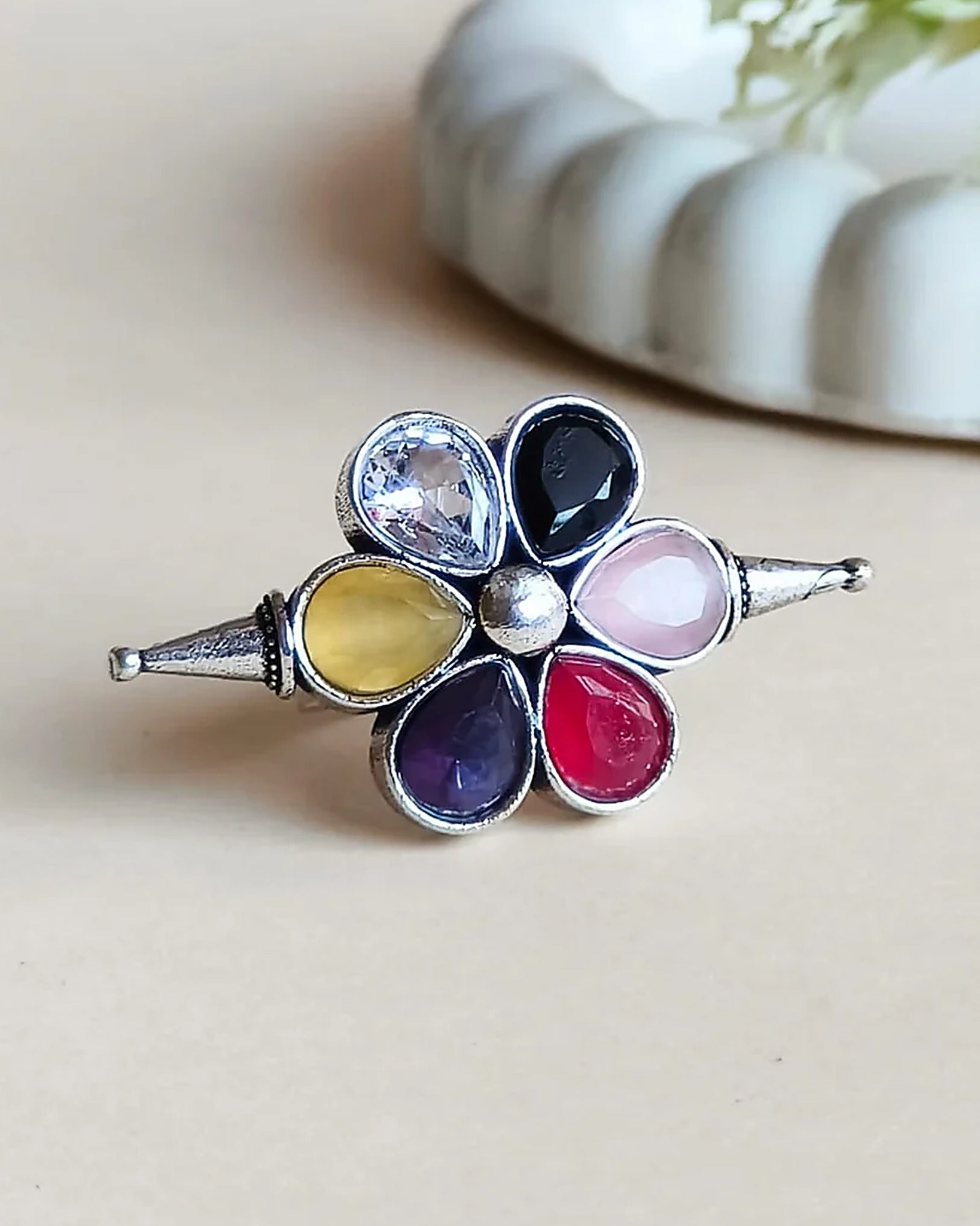 Oxidised silver-look brass adjustable ring shaped as a flower set with yellow, blue, pink, red and purple stones