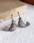 Oxidised silver-look brass drop earrings shaped as a bird in flight with fine engraved detailing