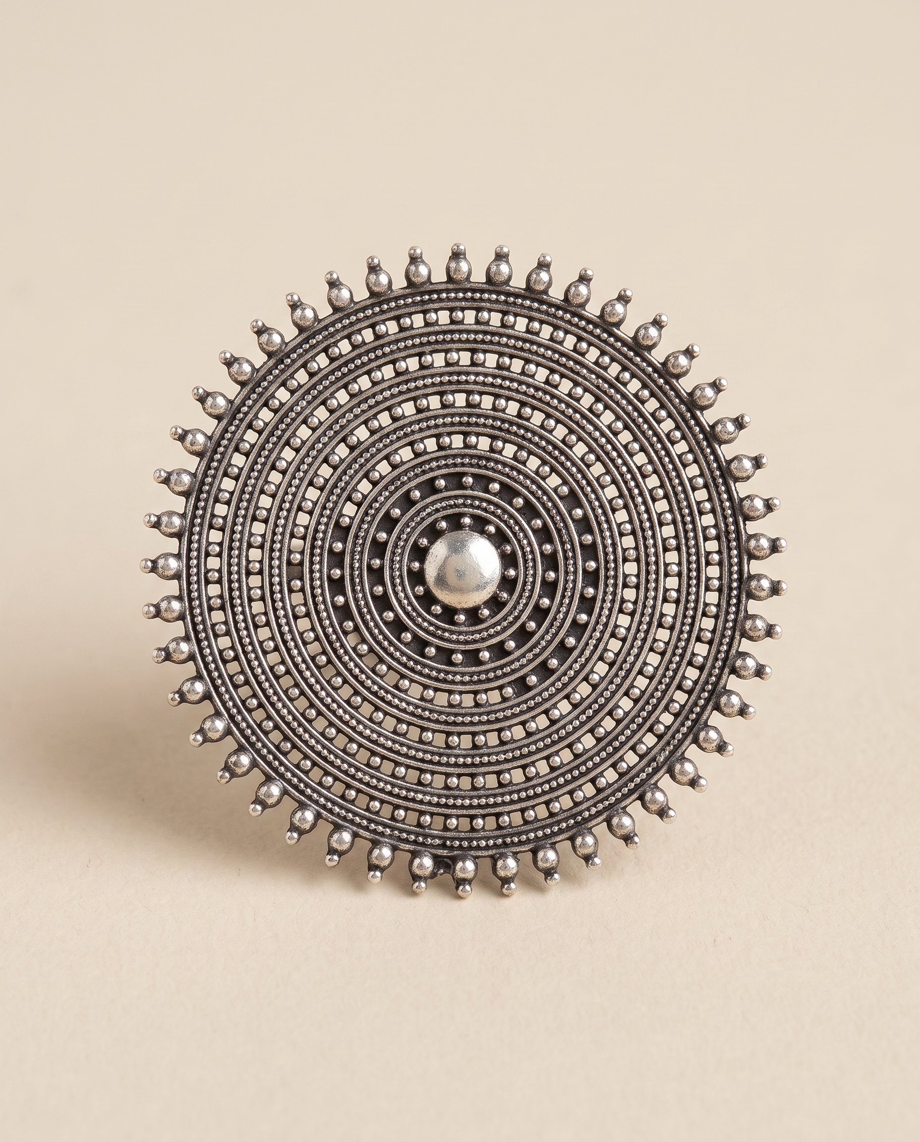 Nishan oxidised silver-look statement ring — a large disc of concentric beaded rings with a sunburst prong edge
