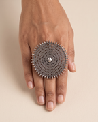 Nishan concentric disc statement ring worn on the middle finger, showing how large it sits on the hand