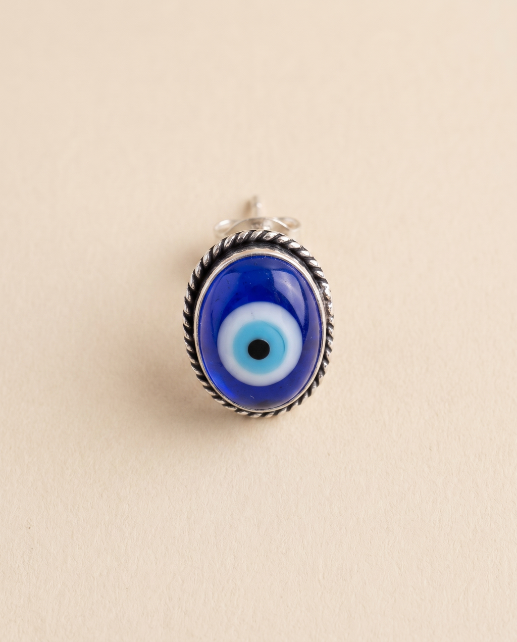 Nazar Battu cobalt blue evil eye stud earring in an oxidised silver rope-edged bezel