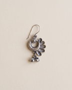 Chandrika oxidised silver-look crescent drop earring with a peacock head, petal fan and small bell drops