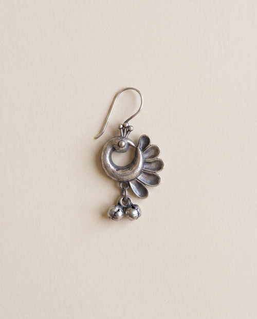 Chandrika oxidised silver-look crescent drop earring with a peacock head, petal fan and small bell drops
