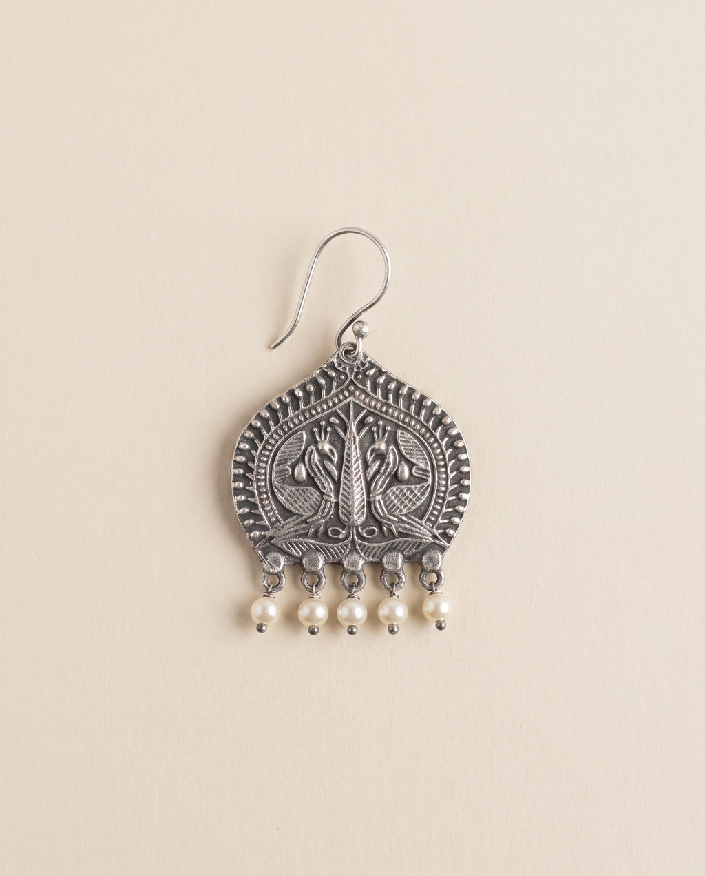 Madhuri oxidised silver-look paan leaf earring engraved with two peacocks, with cream pearl drops