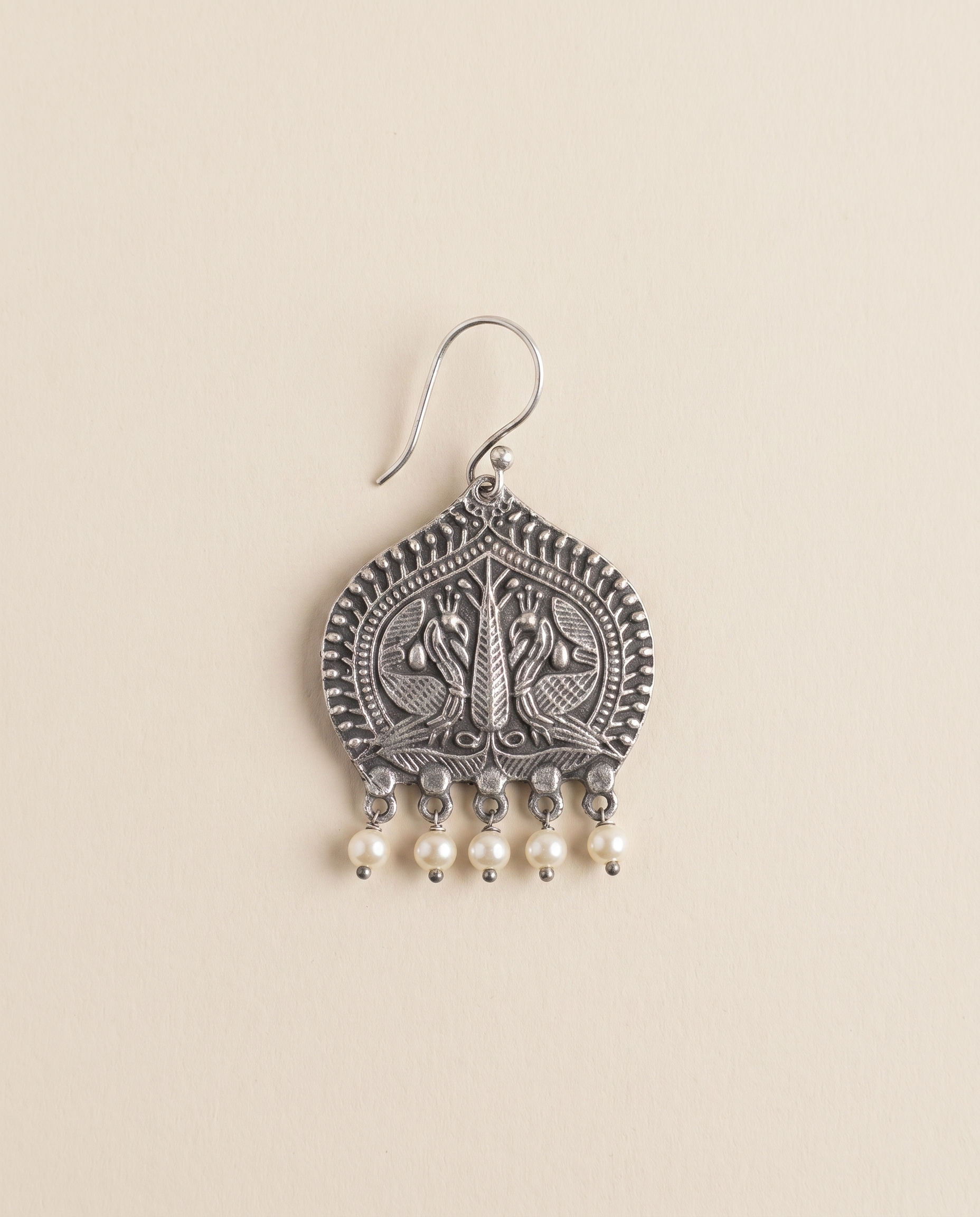Madhuri oxidised silver-look paan leaf earring engraved with two peacocks, with cream pearl drops