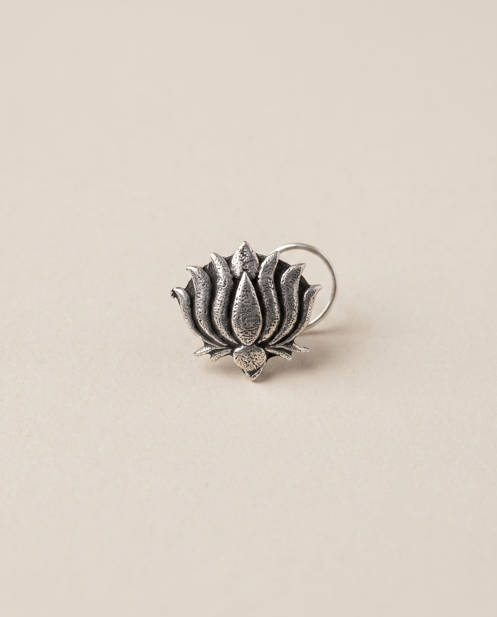 Kamal oxidised silver-look open lotus nose pin with layered pointed petals and a curved wire fitting