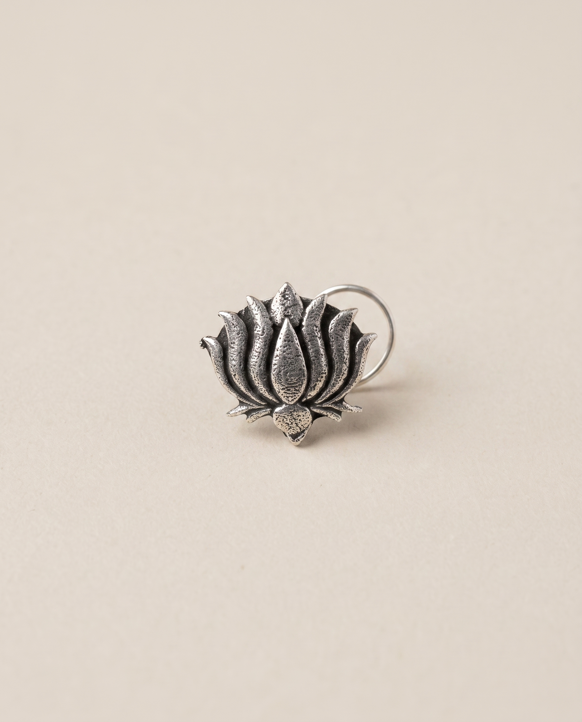 Kamal oxidised silver-look open lotus nose pin with layered pointed petals and a curved wire fitting