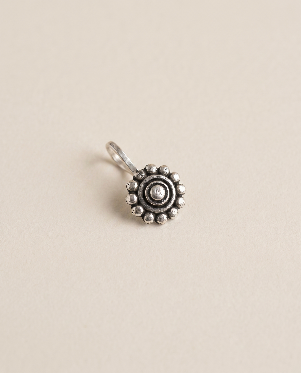 Phool oxidised silver-look round floral disc clip-on nose pin with a beaded border