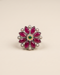 Anant oxidised silver-look flower ring with ruby-magenta marquise stones, cream pearls and a green centre stone in a gold bezel