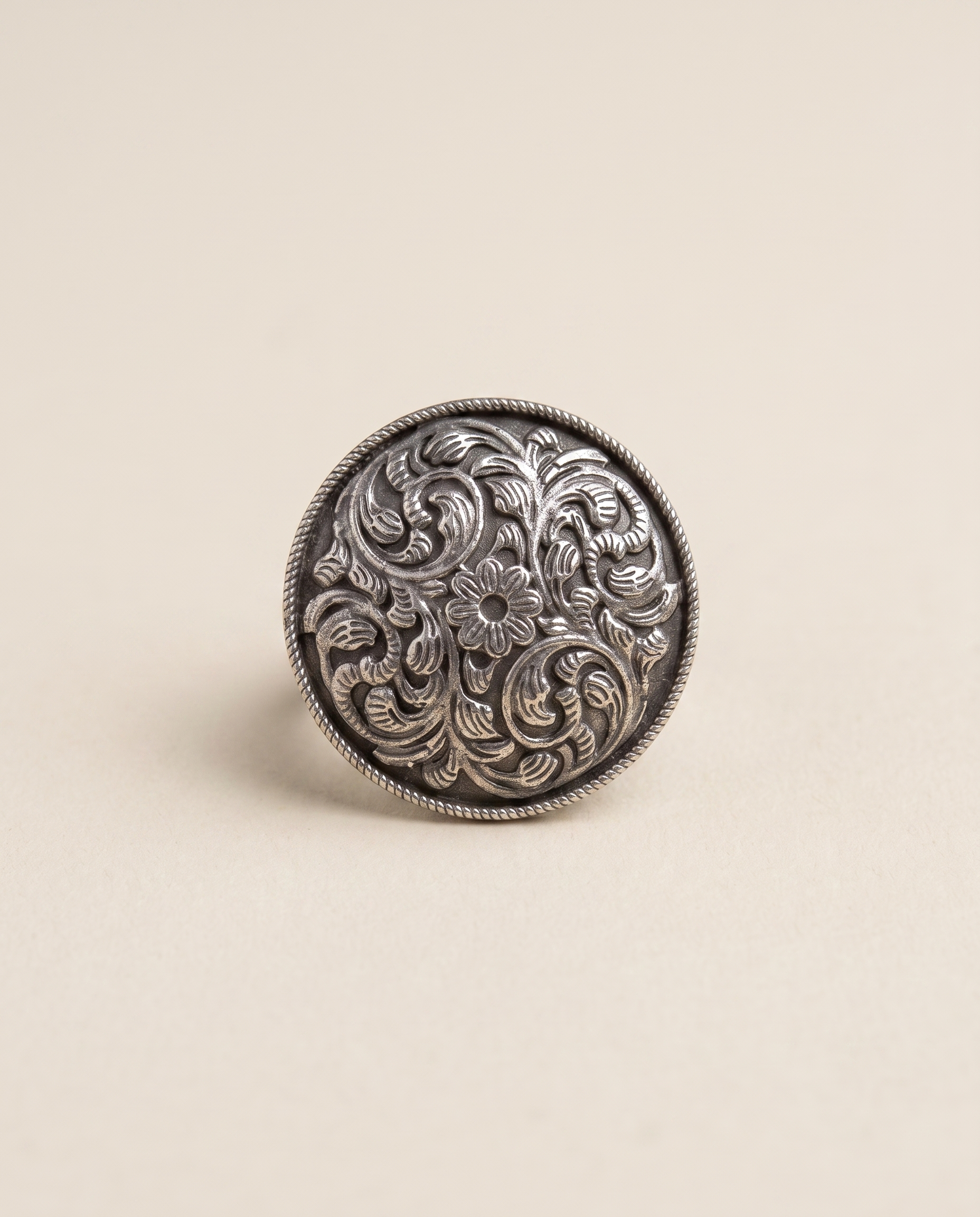 Vipra oxidised silver-look ring with a domed top covered in swirling paisley engraving