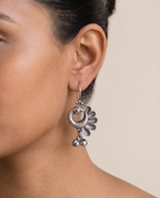 Chandrika crescent peacock earring worn on the earlobe