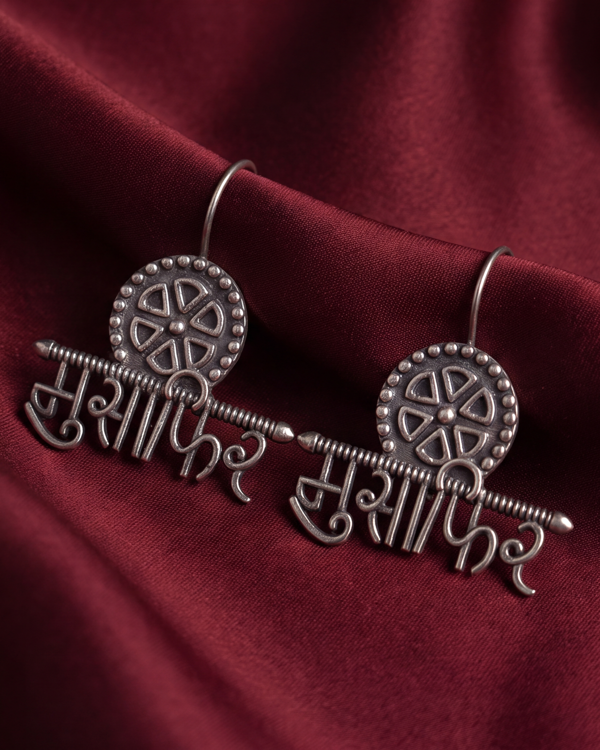 Musafir Oxidised Silver-Look Devanagari Drop Earrings on oxblood satin
