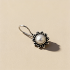 Freshwater pearl drop earrings on a light background