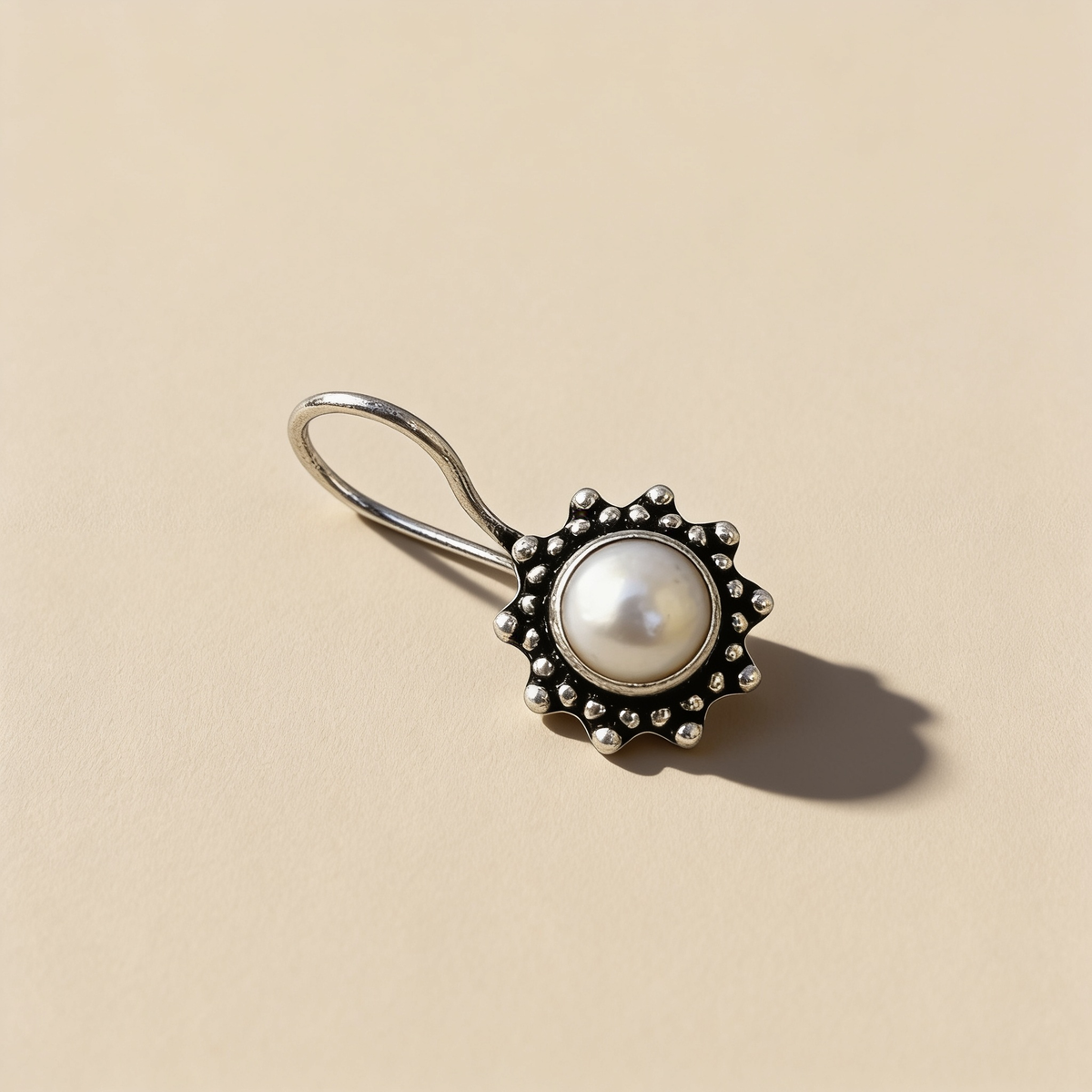 Freshwater pearl drop earrings on a light background