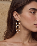 Freshwater pearl waterfall drop earrings shown worn, second angle