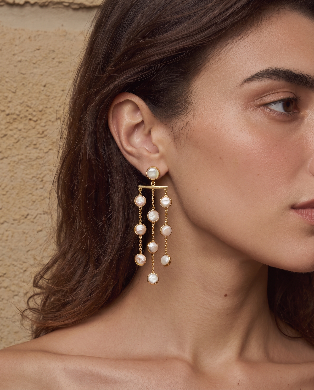 Freshwater pearl waterfall drop earrings shown worn, second angle