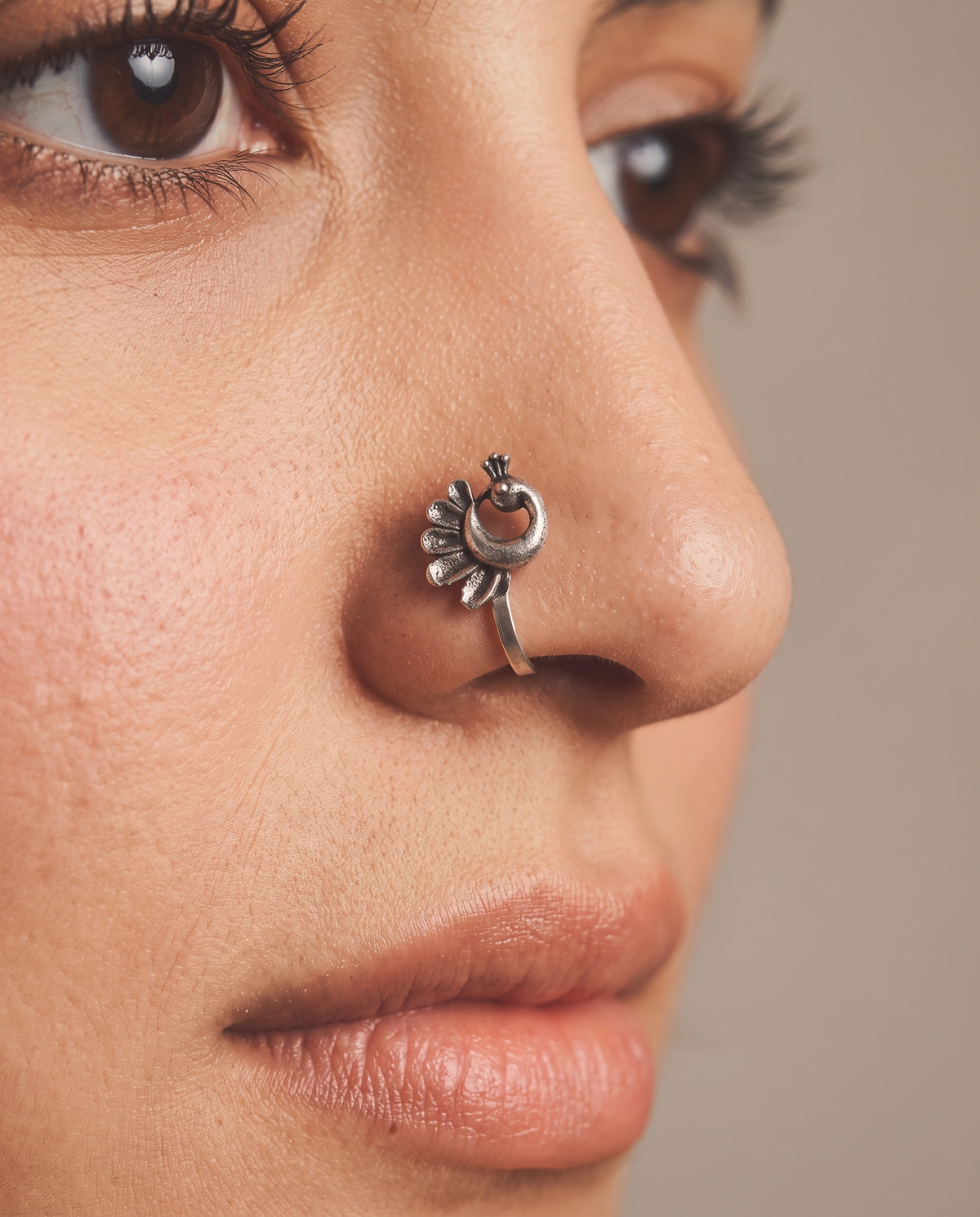 Urban Tevar Morni peacock clip-on nose pin worn on model