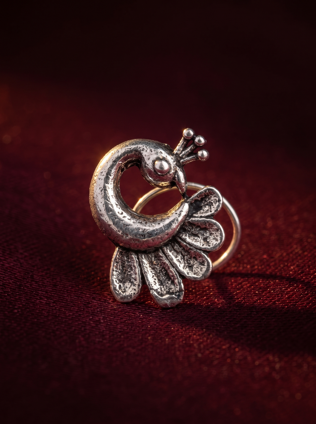Urban Tevar Morni peacock oxidised silver piercing nose pin, oxblood backdrop