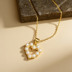 Pearl heart pendant necklace on a light background