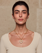 Pearl heart pendant necklace worn on a model