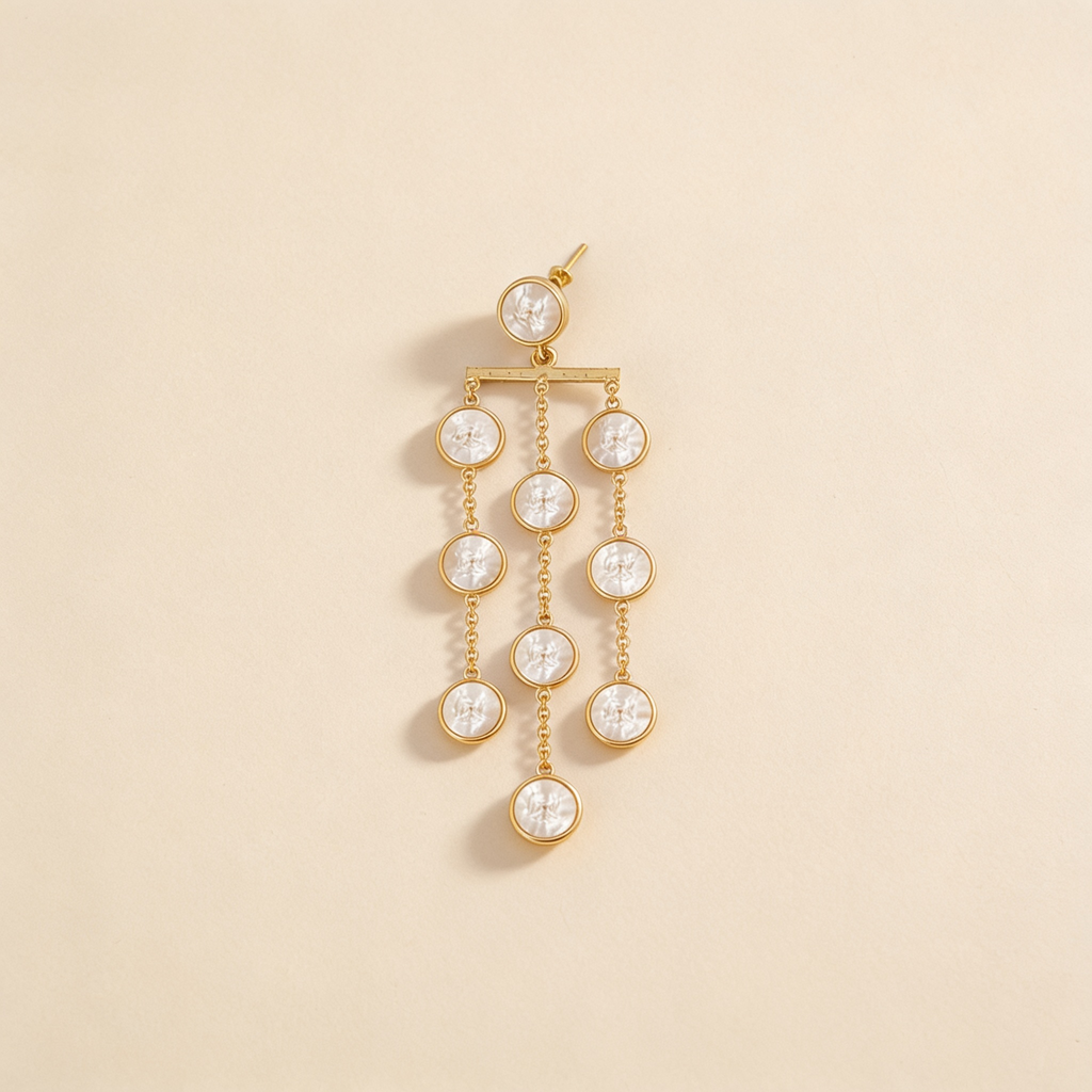 Pearl waterfall drop earrings on a light background