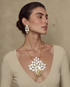 Royal Bloom mother-of-pearl necklace and earrings set worn on a model