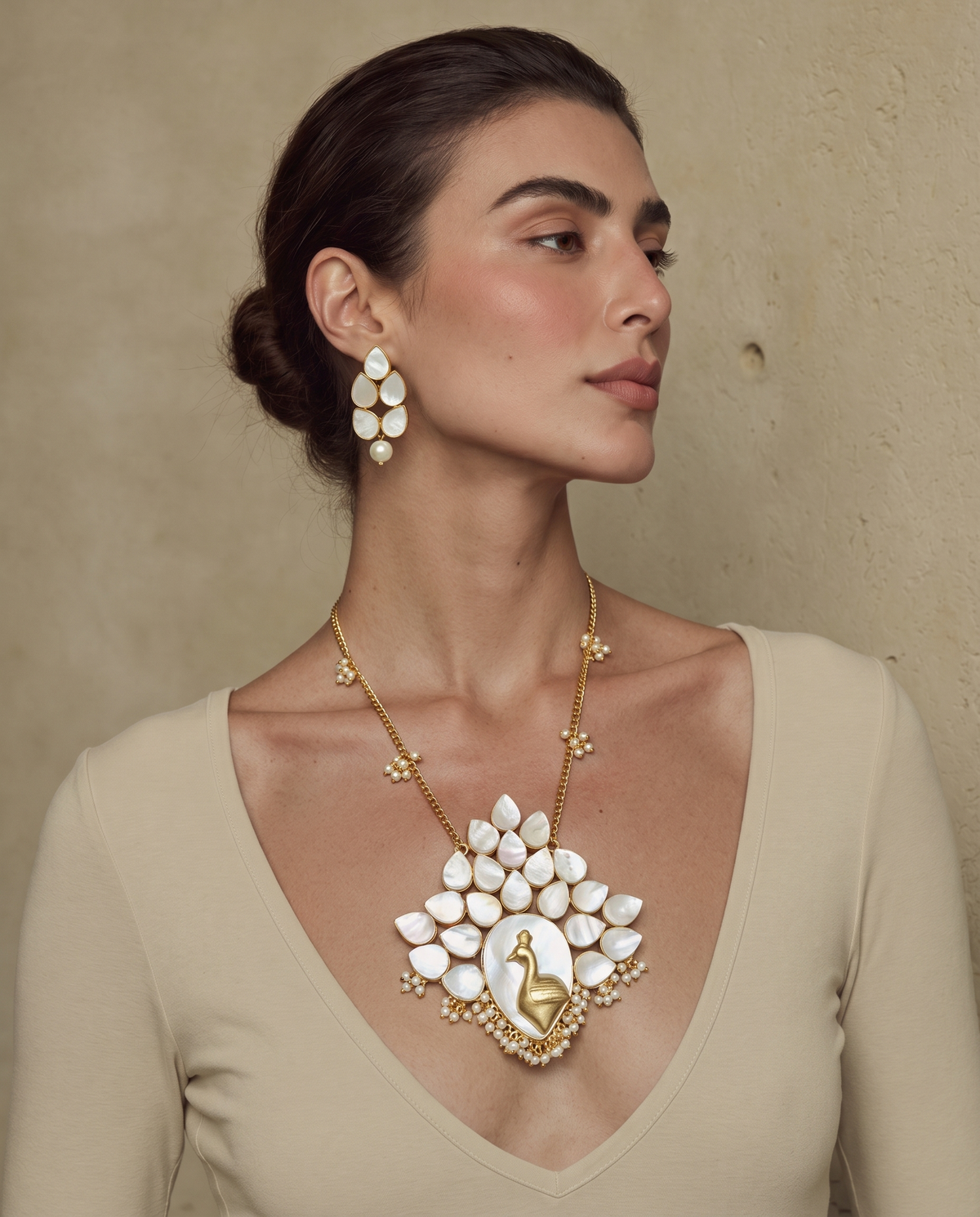 Royal Bloom mother-of-pearl necklace and earrings set worn on a model