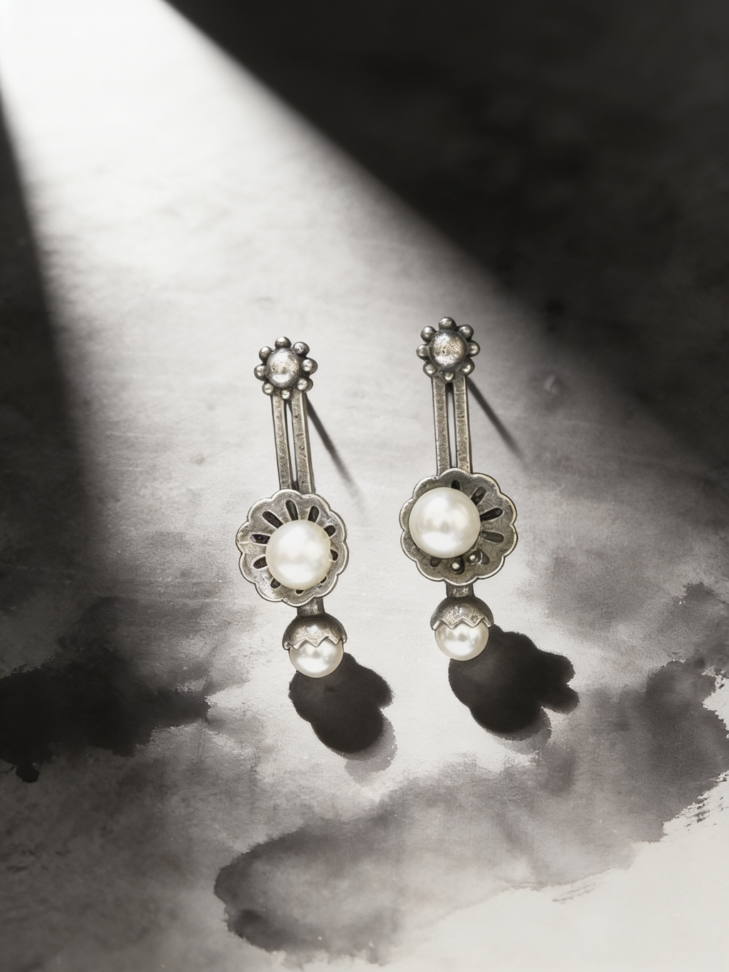 Sattu oxidised silver-look earrings on a graphite studio backdrop