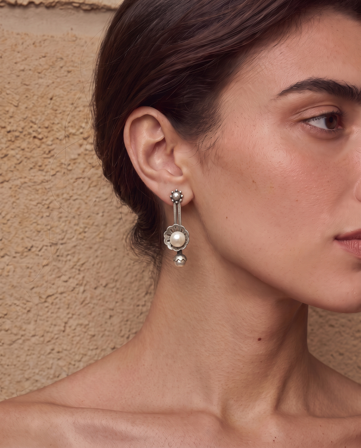 Sattu oxidised silver-look earrings worn on a model