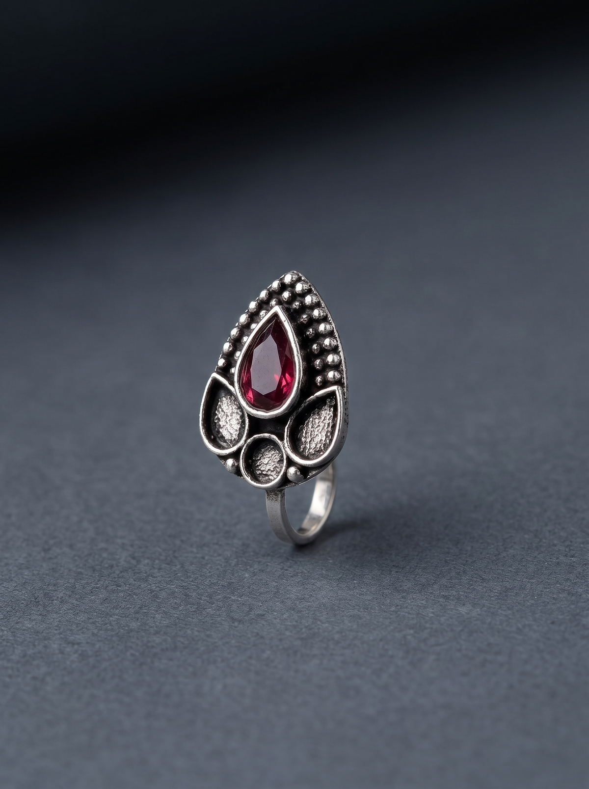 Urban Tevar Zari teardrop nose pin with red stone, dark aesthetic