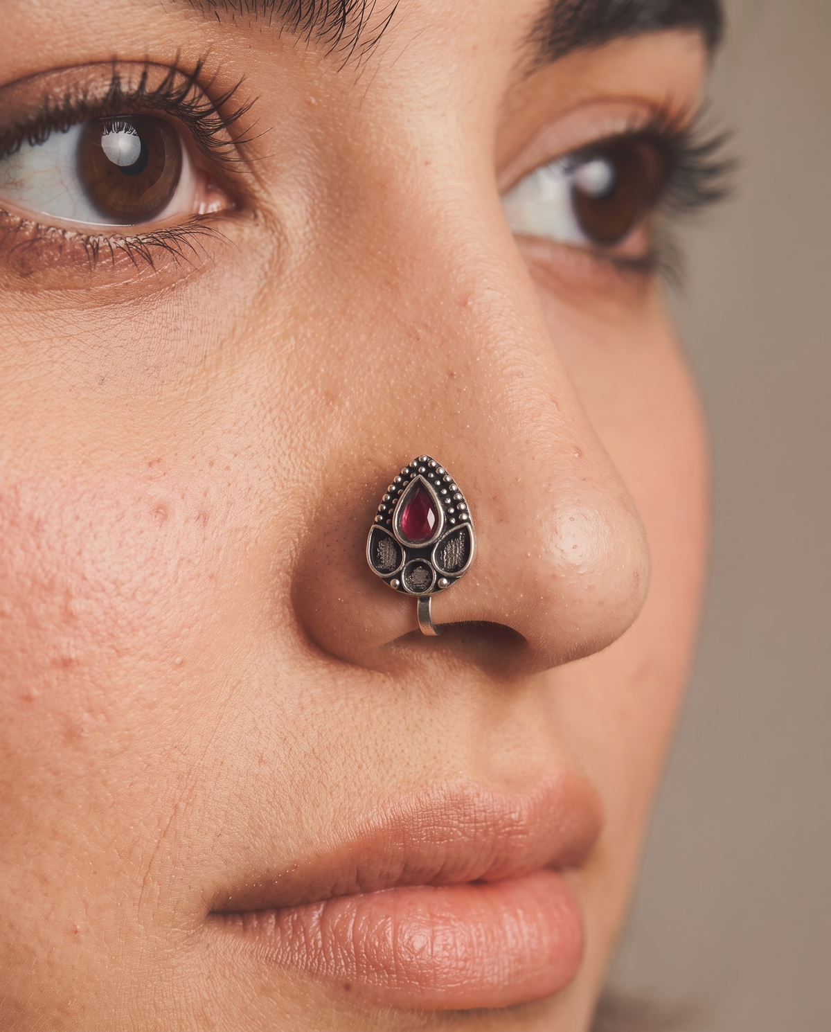 Urban Tevar Zari teardrop nose pin with red stone worn on model